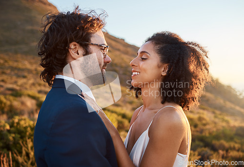 Image of Wedding, trust and bride with groom on mountain for marriage ceremony, commitment and celebration. Love, intimate embrace and happy interracial couple hug on romantic vacation, honeymoon and holiday