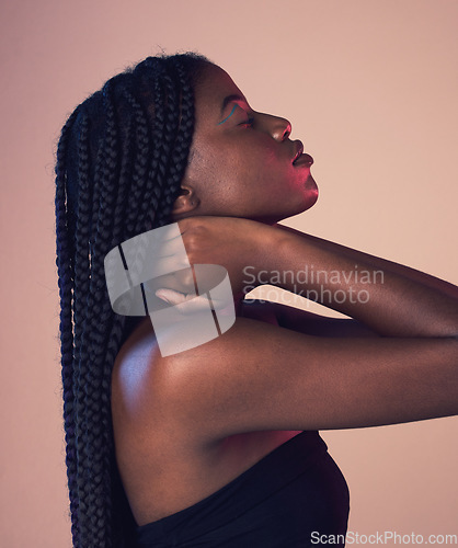 Image of Black woman profile, face and braids with eyes closed, makeup and beauty isolated on studio background. Natural cosmetics, hair and hairstyle with cosmetic care, wellness and African model is content