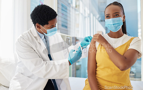 Image of Vaccine, doctor and patient with health, Covid and hospital, black people with healthcare and injection. Medicine for safety against virus, needle syringe and man with woman in mask for Corona