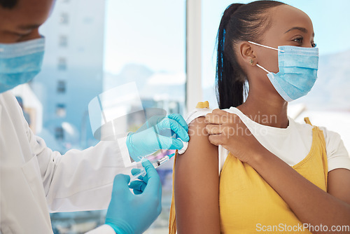 Image of Vaccine, doctor and patient with health, Corona and hospital, black people with healthcare and injection. Medicine for safety against virus, needle syringe and man with woman in mask for Covid
