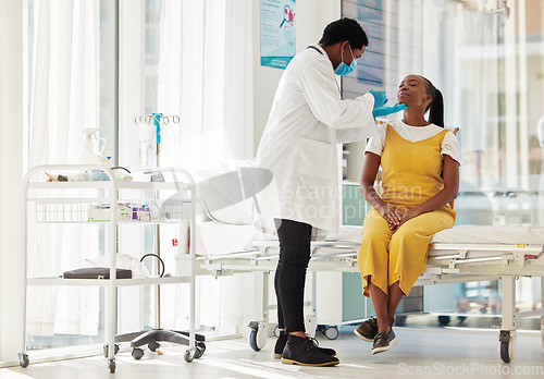 Image of Covid, healthcare and test with a black woman patient talking to a doctor for consulting during a checkup. Compliance, medical and insurance with a female in a hospital testing for the corona virus