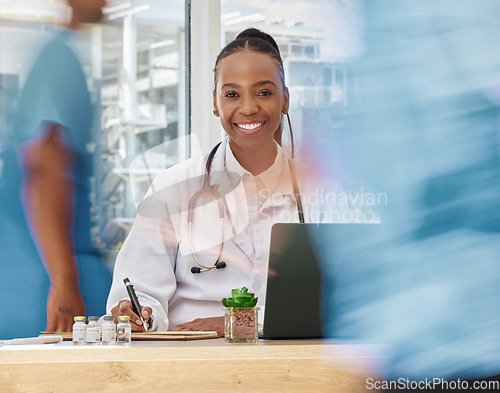 Image of Portrait, black woman and doctor writing in hospital or busy clinic. Healthcare, wellness and happy female physician with laptop taking notes in book, paperwork or covid research in medical office.