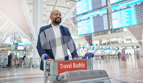 Image of Travel, airport or black man walking with suitcase, luggage or bags in trolley at customs with a happy smile. Airplane, pride or African businessman traveling via international flight transportation