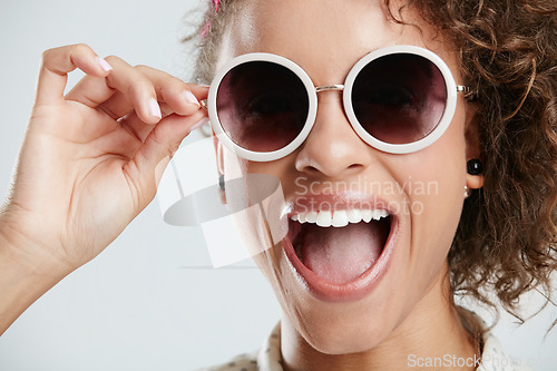 Image of Beauty, sunglasses and face of woman with smile on white background for summer, casual and trendy style. Creative, accessory and zoom of excited girl in studio with cosmetics, makeup and confidence