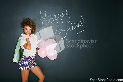 Image of African woman, balloons and happy birthday present for party fun, happiness and wow celebration. Young black woman, smile portrait and festive sign, event announcement and excited with gift in studio