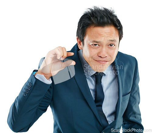 Image of Portrait, hand or small with a business asian man in studio isolated on a white background to measure size. Face, gesture or little and a male employee giving a review or feedback with a finger scale