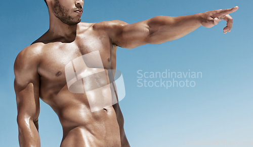 Image of Fitness, blue sky and point of a nude man and wellness man model with mockup space. Summer, naked body and strong muscle of person with stomach muscles pointing and sun bathing outdoor in sunshine