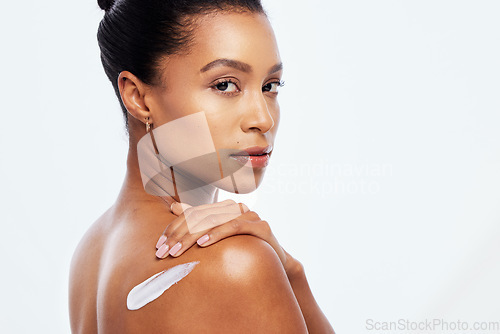 Image of Woman portrait, beauty and body cream on skin in studio for dermatology, cosmetic and natural glow space. Aesthetic model person with luxury lotion and hand on shoulder isolated on a white background