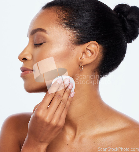 Image of Beauty, skincare and cotton for face cleaning in studio with dermatology cosmetics for natural skin. Aesthetic model person with spa facial and healthy detox glow isolated on a white background