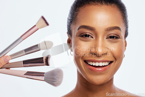 Image of Beauty, makeup brush and face for woman portrait in studio for dermatology, cosmetic and natural glow. Happy aesthetic model person with facial tools for a healthy skin isolated on a white background