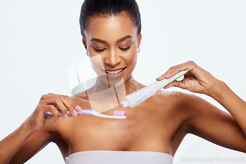 Image of Dental hygiene, grooming and woman brushing teeth isolated on white background in a studio. Health, cleaning and model with toothpaste and a toothbrush for a healthy mouth and oral care on a backdrop