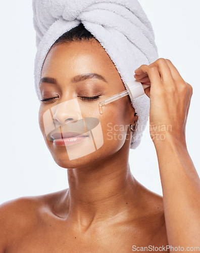 Image of Beauty, skincare oil and face of a woman in studio for dermatology, cosmetics and natural skincare. Aesthetic model with collagen spa facial serum and a healthy glow isolated on a white background