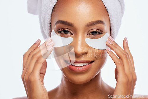 Image of Black woman, beauty and eye patch portrait in studio for dermatology, cosmetics and natural skincare. Face of aesthetic model with collagen spa facial and healthy glow isolated on a white background