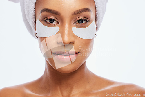 Image of Beauty, eye patch and skincare for woman portrait in studio for natural dermatology. Aesthetic model for spa facial, towel and healthy or clean face glow cosmetic product isolated on white background