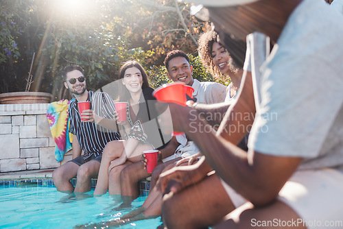 Image of Vacation, drinks and friends speaking in a pool at a summer party, celebration or event at a home. Diversity, happy and people talking, having fun and bonding by the swimming pool while drinking.