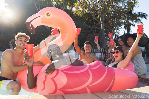 Image of Beer, pool party and friends on flamingo, having fun and partying on new year. Summer celebration, water event or group portrait of drunk funny people laughing with alcohol, swimming or float on bird