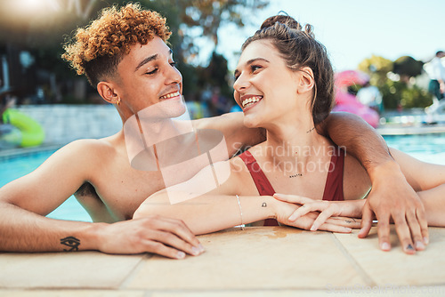 Image of Party, swimming and diversity with a couple of friends in the pool outdoor together during summer. Love, water and swim with a young man and woman swimmer enjoying a birthday or celebration event