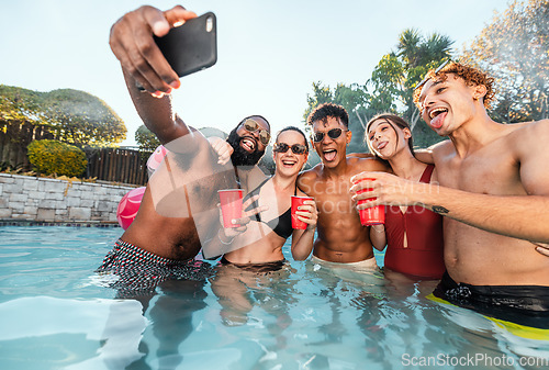 Image of Selfie, beer and friends at pool party having fun on new years. Swimming celebration, water event and group of happy people with tongue out, peace sign and taking pictures for social media in summer.