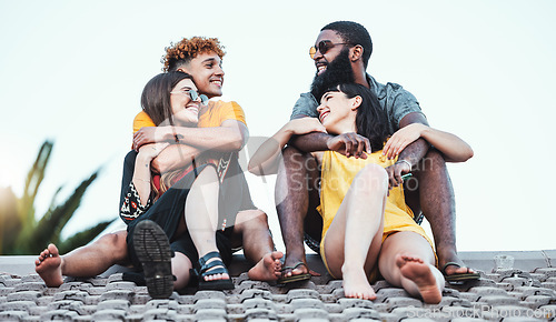 Image of Relax, happy and couple of friends on a roof for communication, happiness and summer in Miami. Conversation, diversity and group of talking men and women on a house for speaking, enjoyment and party