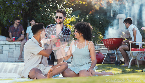 Image of Party, diversity and toast with friends outdoor together at a bbq in summer for a social event or celebration. Alcohol, cheers or birthday with a young man and woman friend group celebrating outside