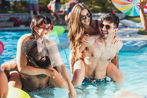 Image of Party, pool and piggyback with a couple of friends having fun while swimming together outdoor during summer. Water, swim and diversity with a man and woman friend group playing games outside
