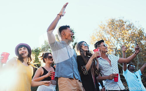 Image of Drinks, party and a crowd of friends outdoor to celebrate at festival, concert or summer social event. Diversity young men and women people together while dancing, happy and excited with alcohol