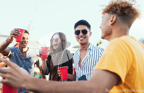 Image of Group of friends, drinks and a party outdoor to celebrate at festival, celebration or summer social event. Diversity young men and women people together while talking, happy and drinking alcohol