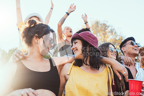 Image of Couple of friends, party and drinks outdoor to celebrate at festival, concert or summer social event. Women people in crowd together while dancing, happy and drinking alcohol with lgbt partner