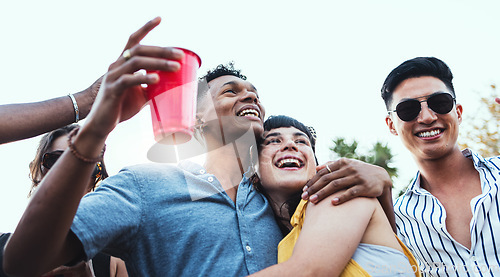 Image of Couple of friends, party and drinks outdoor to celebrate at festival, concert or social event. Diversity young men and women people together while dancing, happy and drinking alcohol in crowd