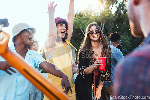 Image of Music, drinks and friends dancing outdoor to celebrate at festival, concert or summer social event. Diversity young men and women people together while excited, happy and drinking alcohol at a party