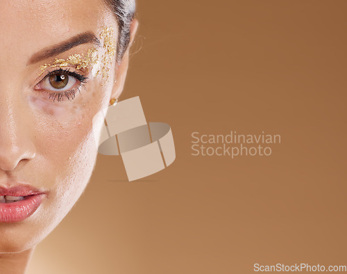 Image of Beauty, glitter and face portrait of woman with luxury gold eyeshadow, cosmetics product and facial makeup glow. Skincare mockup, spa salon and aesthetic model girl with sparkle, shine and wellness