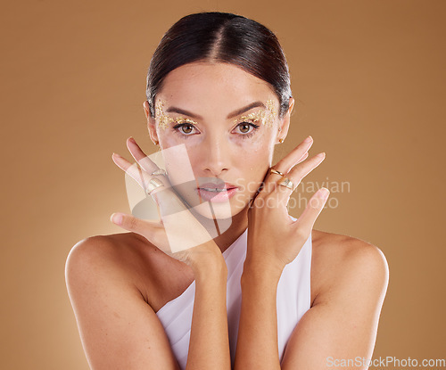 Image of Gold portrait, glitter makeup or woman with luxury eyeshadow, cosmetics product and skincare glow. Beauty girl, spa salon or aesthetic model face with jewelry ring, accessories or vitiligo healthcare