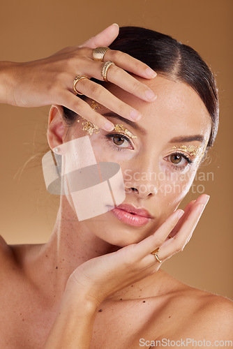 Image of Gold beauty, face glitter or woman with luxury eyeshadow, cosmetics product and skincare glow. Makeup girl, spa salon or aesthetic portrait model with jewelry ring, accessories or vitiligo healthcare