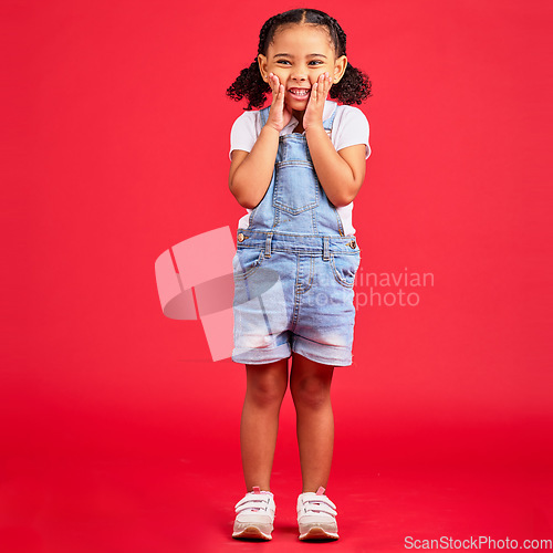 Image of Happy, youth and portrait of girl on red background for happy childhood, positive mindset and smile. Fashion, summer style and cute face of girl in studio with funny, comic and meme facial expression