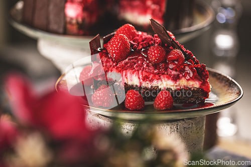 Image of Slice of chocolate cake with raspberries