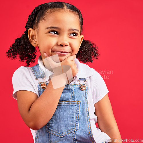 Image of Little girl, face or thinking hand on chin on isolated red background in games innovation, studio question or fun vision. Smile, happy or curious child with ideas, fashion clothes or curly hair style