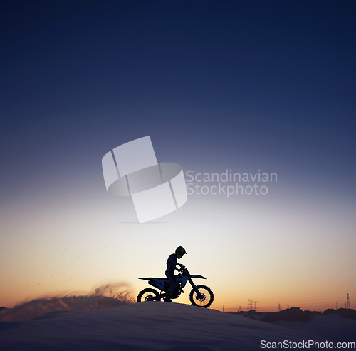 Image of Silhouette, sport and riding motorcycle against night, sky and background in nature, extreme sports and adrenaline. Biking, motorbike and person driving on dirt road, dark and shadow, stunt and free