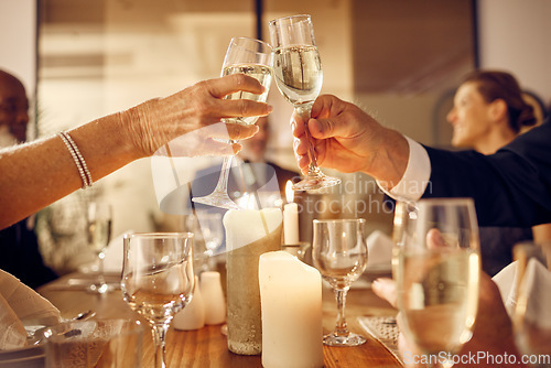 Image of Success, hands or toast in a party in celebration of goals, achievement or new year at luxury event. Motivation, congratulations or people cheers with champagne drinks or wine glasses at dinner gala