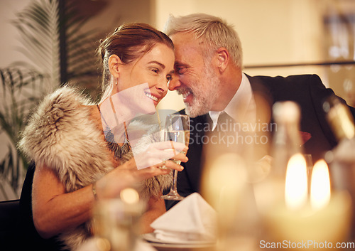 Image of Woman, man and whisper at dinner, party or restaurant for celebration in night with smile, happy and gossip. New year, fine dining or gala event with champagne, conversation and romantic secret love