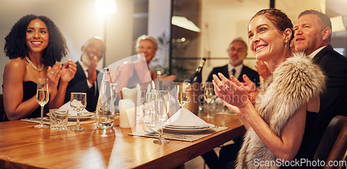 Image of People, restaurant and clapping at celebration in night for friends, business executive team or happy for success. New year, applause or gala party with champagne, congratulations or group motivation