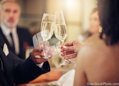 Image of Success, hands or champagne toast in a party in celebration of goals, achievement or new year at luxury event. Motivation, congratulations or friends cheers with drinks or wine glasses at dinner gala