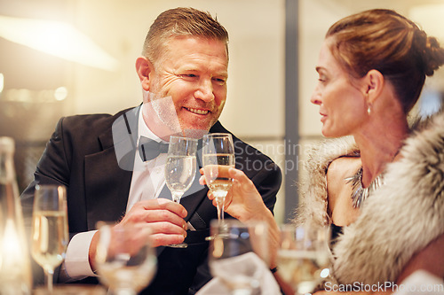 Image of Success, toast or happy couple in a party in celebration of goals, achievement or new year at luxury event. Motivation, smile or people cheers with champagne drinks or wine glasses at fun dinner gala