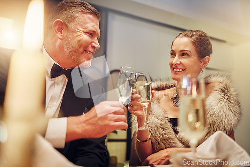 Image of Success, love or happy couple toast in a party in celebration of goals or new year at luxury event. Motivation, congratulations or people cheers with champagne drinks or wine glasses at dinner gala