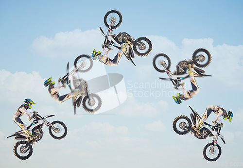 Image of Motorcycle, sky jump race and air stunt for extreme sport expert for agile speed, power or balance in nature. Motorbike man, clouds and flip on fast vehicle with helmet, safety clothes and motivation