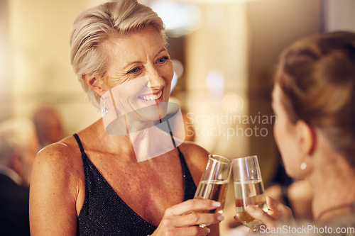 Image of Success, happy or women toast in a party for goals, winning or new year at luxury social event. Mature, celebration or senior friends cheers with champagne drinks or wine glasses at a fun dinner gala