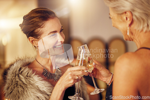 Image of Success, women or toast in a party for goals, winning or new year at luxury social event. Mature, celebration or happy senior friends cheers with champagne drinks or wine glasses at a fun dinner gala