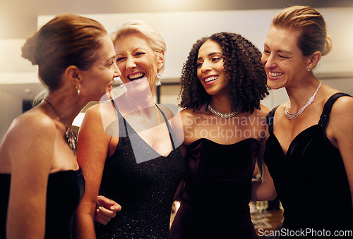 Image of Happy, funny or friends hug in a party in celebration of goals or new year at a luxury womens social event. Smile, girls night or people speaking, talking or bonding at dinner gala laughing at gossip