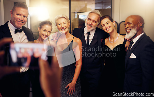 Image of Phone photography, success or friends in a party to celebrate goals or new year at fancy luxury event. Women, senior or happy people smile in pictures for social media at dinner gala or fun birthday