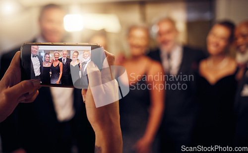 Image of Phone photography, hands or people in a party to celebrate goals or new year at luxury event. Women, screen or group of friends smile in pictures for social media at fun dinner gala or happy birthday