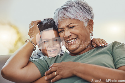 Image of Happy, grandmother and grandchild on a sofa, smile and laugh, love and family while bonding in their home. Relax, grandma and child embrace, funny and joke on a couch, loving and sweet in living room